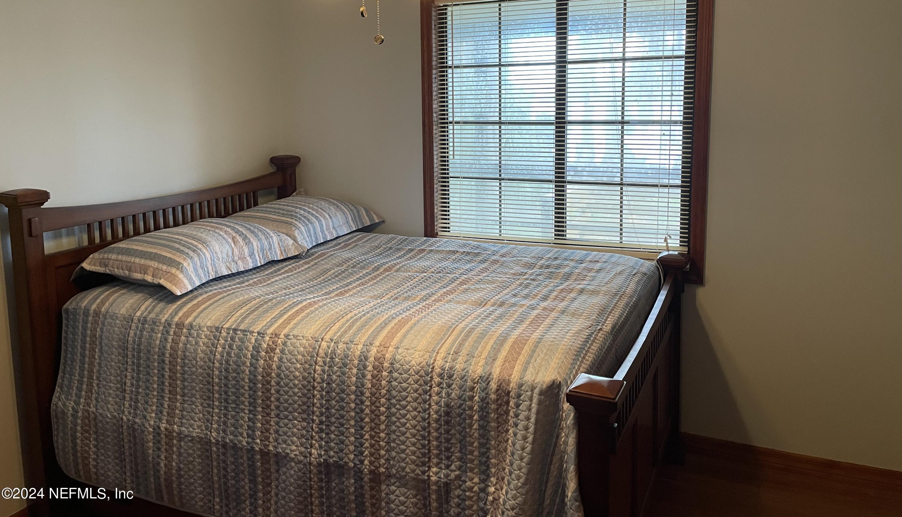 110 North Point Drive Georgetown, FL 32139 - Photo 14 of 28 a bedroom with a bed and a window