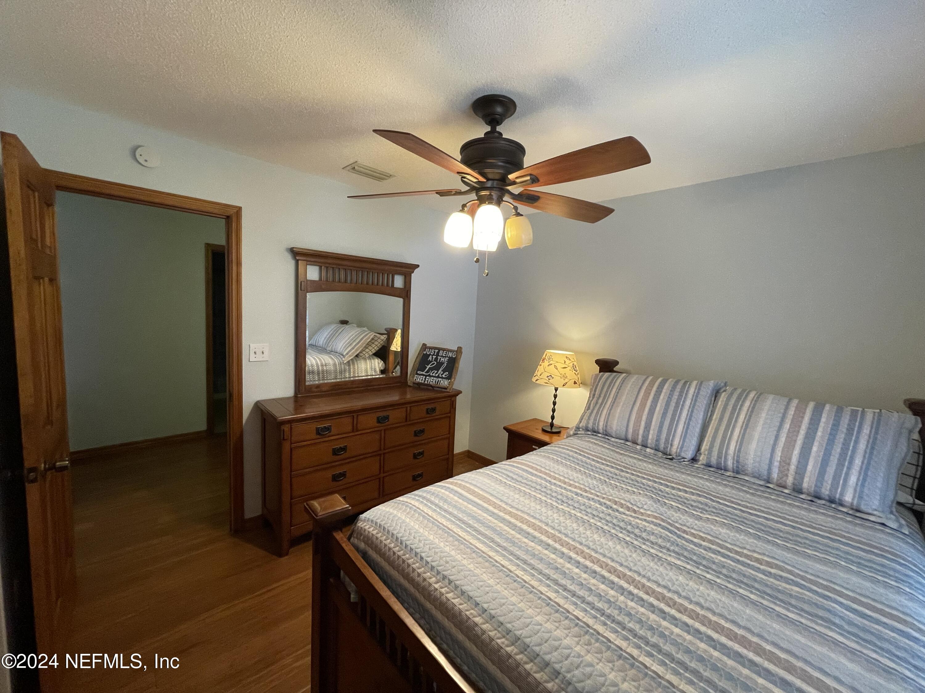 110 North Point Drive Georgetown, FL 32139 - Photo 15 of 28 a bedroom with a bed and a dresser