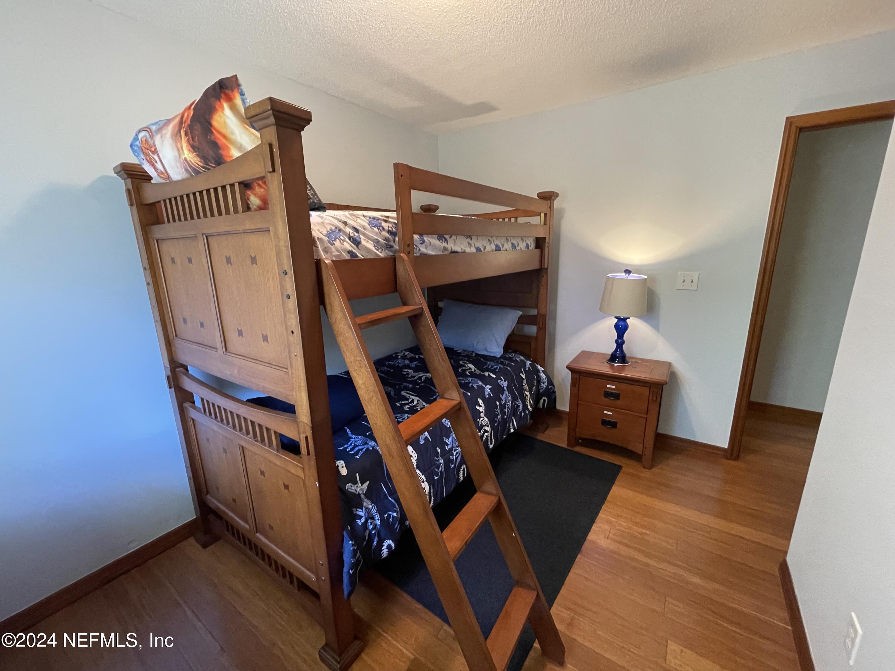 110 North Point Drive Georgetown, FL 32139 - Photo 19 of 28 a living room with furniture and a flat screen tv