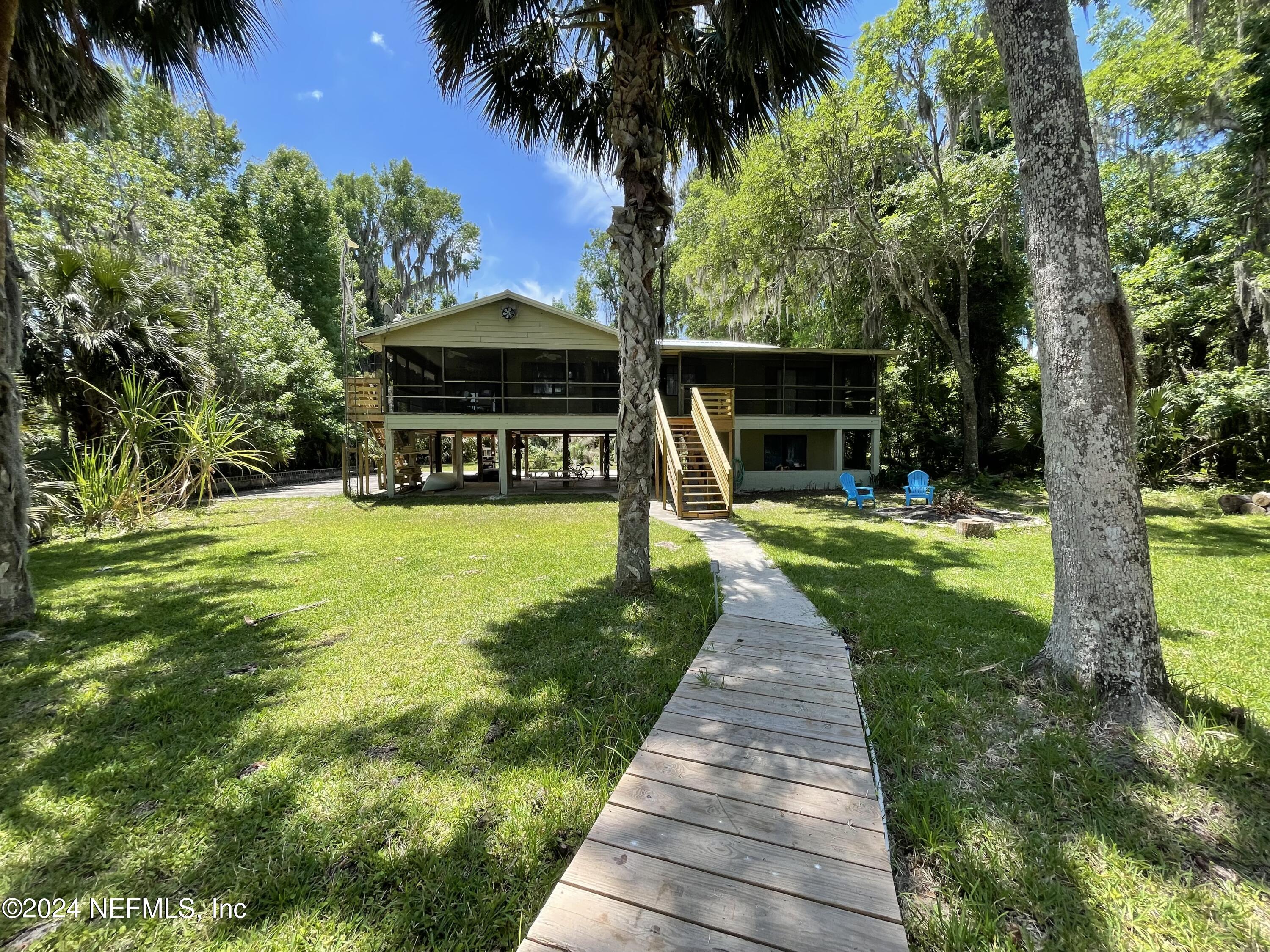 110 North Point Drive Georgetown, FL 32139 - Photo 2 of 28 a view of swimming pool with a garden