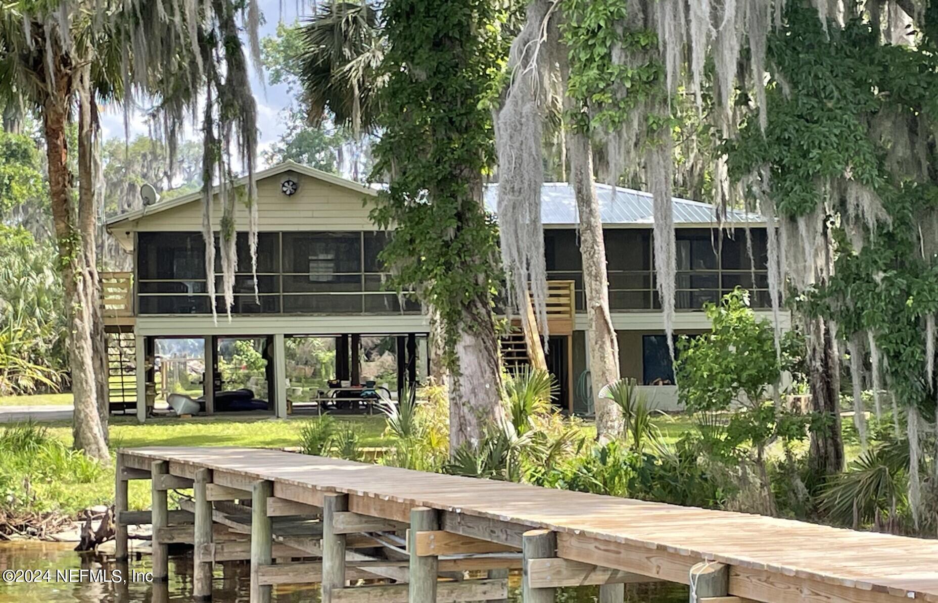 110 North Point Drive Georgetown, FL 32139 - Photo 28 of 28 a front view of a building with a garden