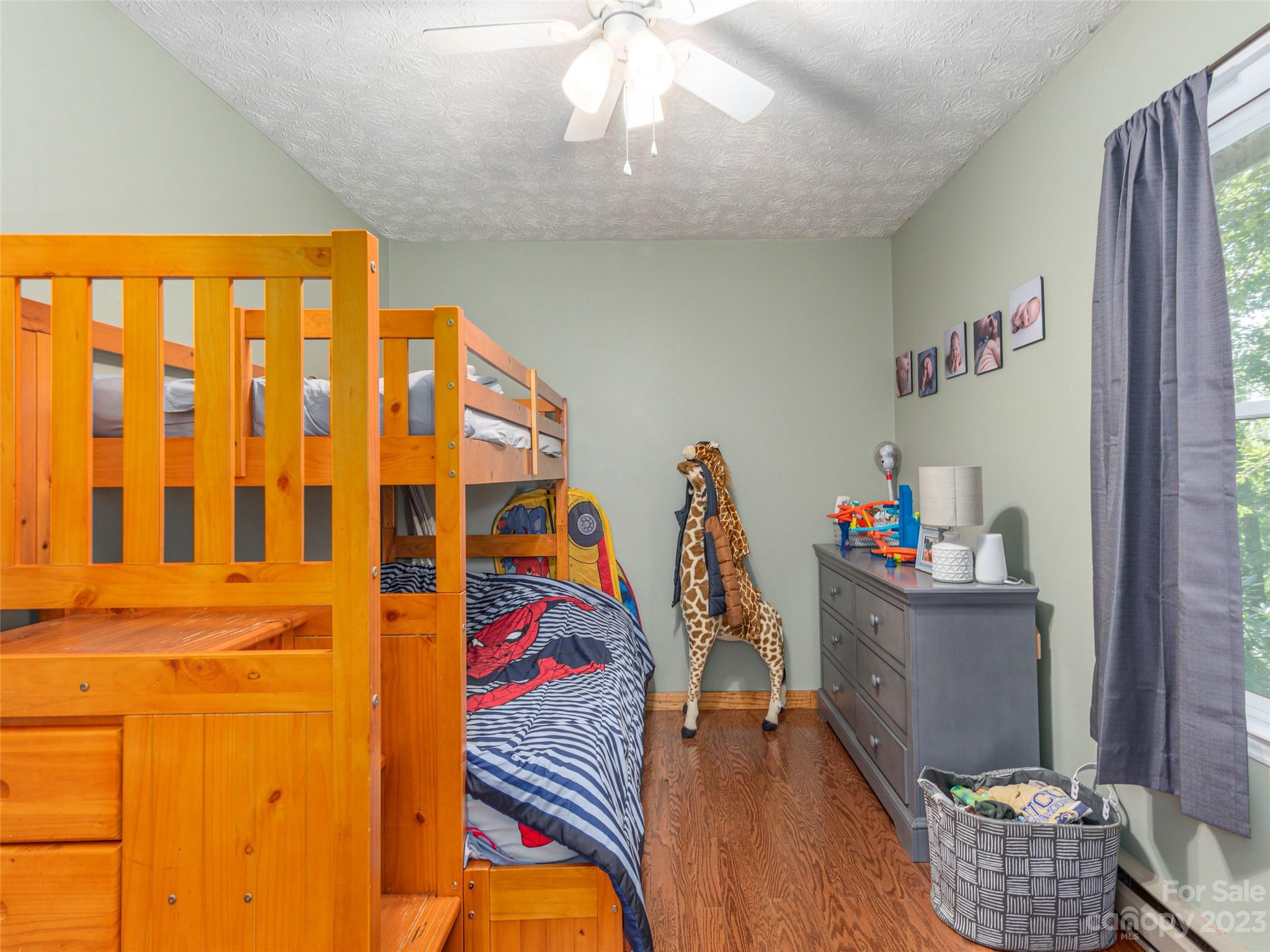 167 Paradise Circle Clyde, NC 28721 - Photo 13 of 18 a room with furniture and a chandelier