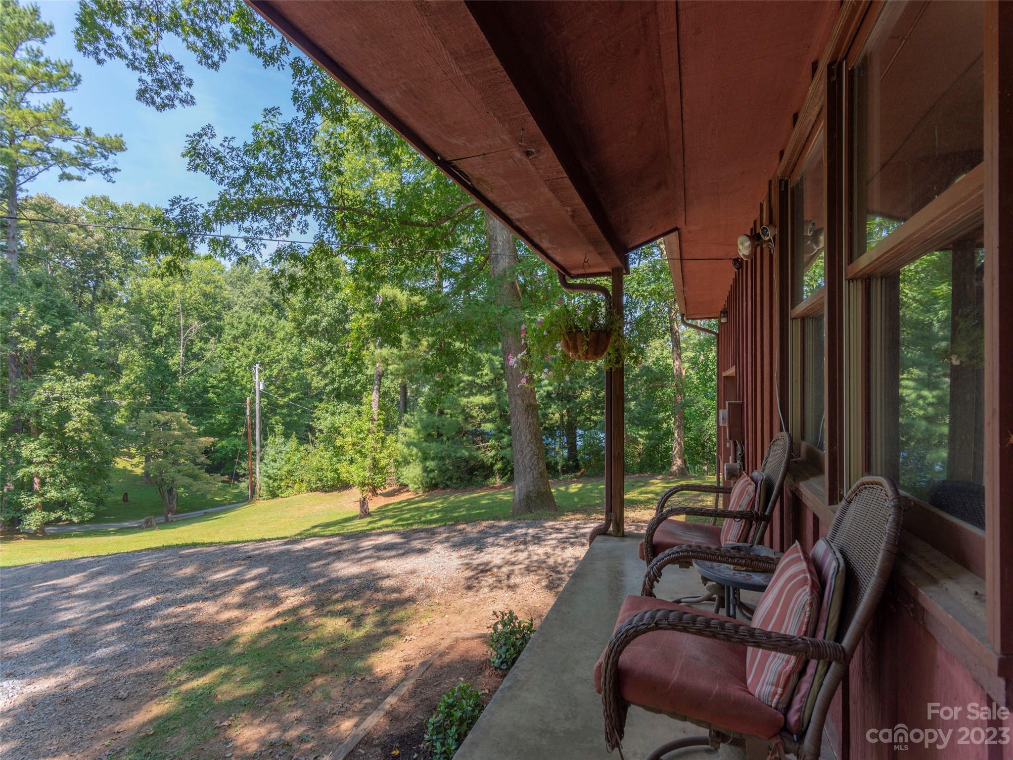 167 Paradise Circle Clyde, NC 28721 - Photo 3 of 18 a view of backyard with outdoor seating and green space