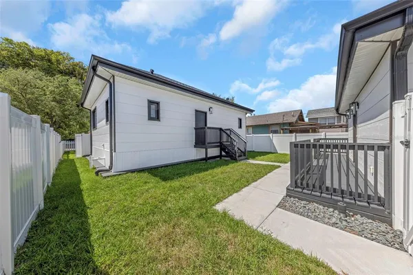 a view of a house with a backyard