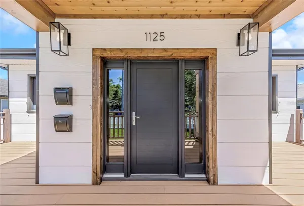 a kitchen with stainless steel appliances a stove a refrigerator and wooden cabinets