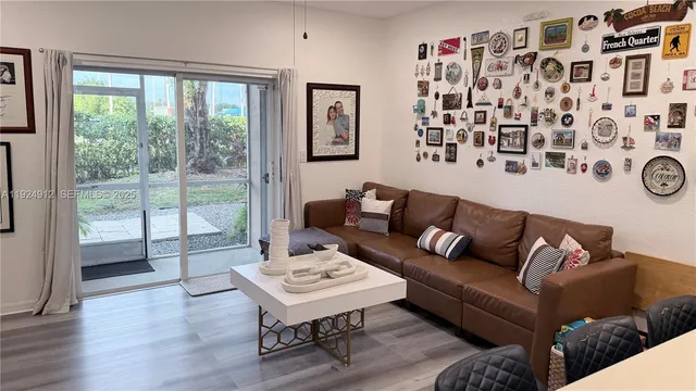 a living room with a couch and a large window