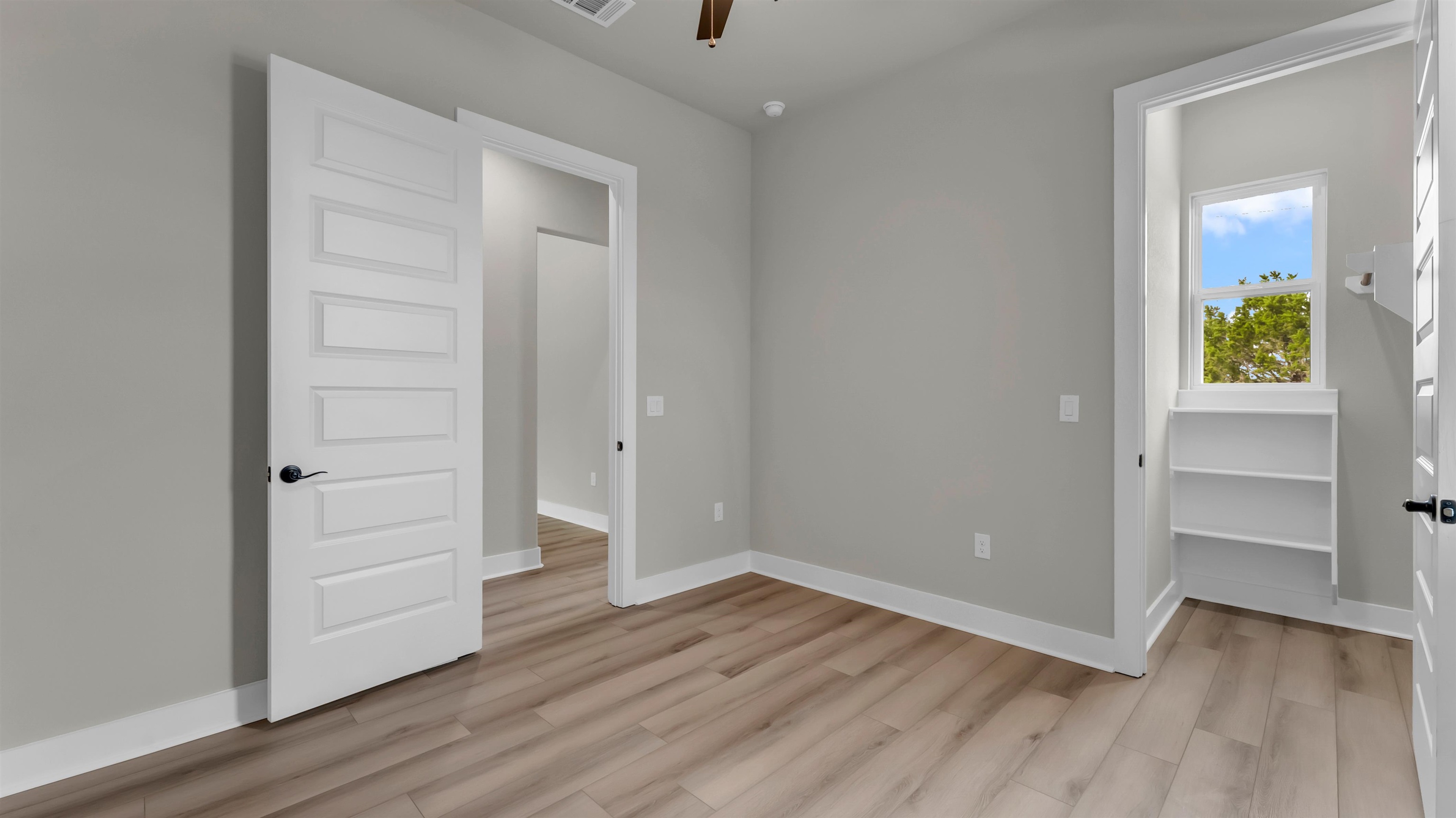 119 Garner Rnch Road Bertram, TX 78605 - Photo 19 of 25 an empty room with wooden floor & closet