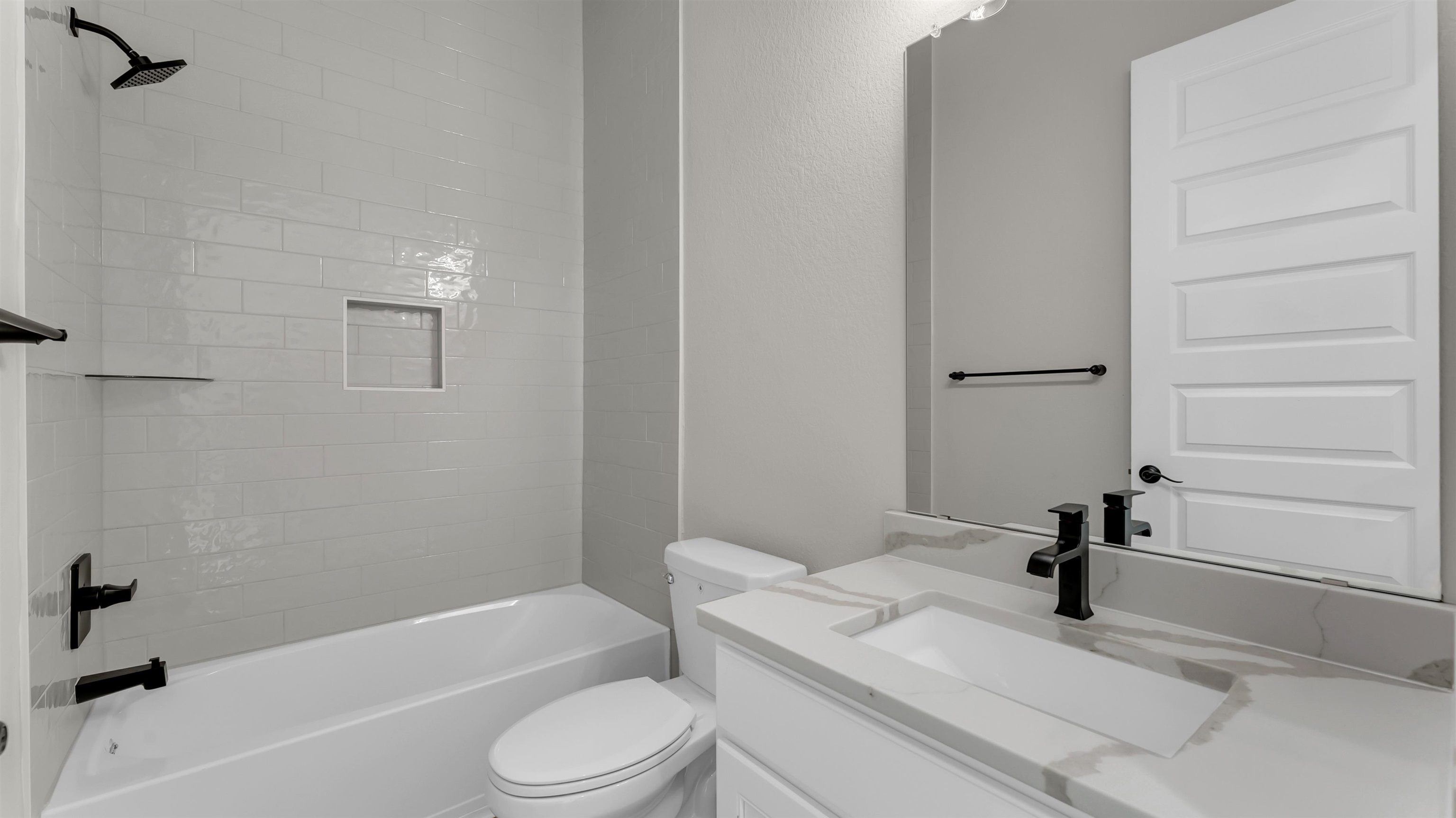 119 Garner Rnch Road Bertram, TX 78605 - Photo 20 of 25 a bathroom with a granite countertop bathtub shower sink vanity and toilet