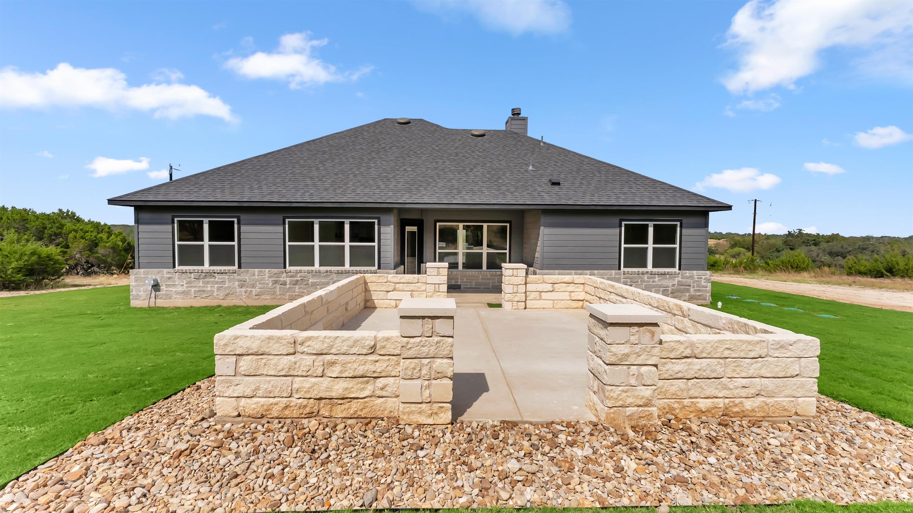 119 Garner Rnch Road Bertram, TX 78605 - Photo 23 of 25 a house with garden in front of it