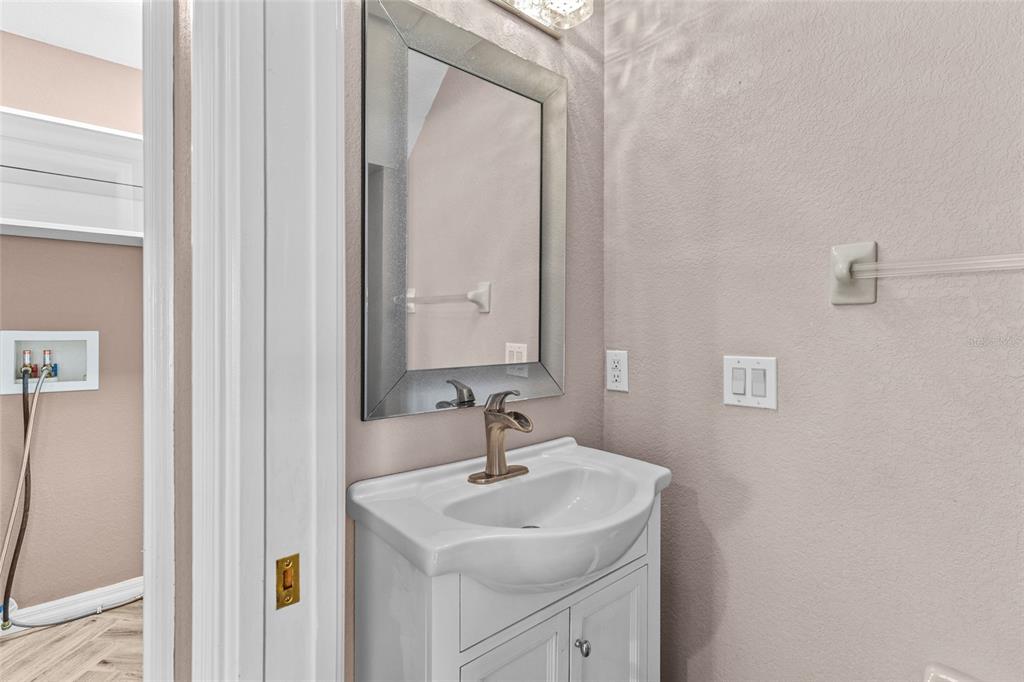 11754 Tempest Harbor Loop Venice, FL 34292 - Photo 13 of 56 a bathroom with a sink and a mirror