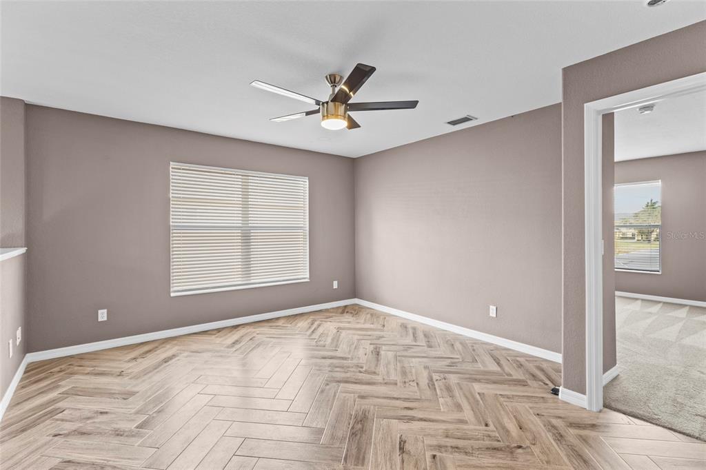 11754 Tempest Harbor Loop Venice, FL 34292 - Photo 15 of 56 a view of an empty room with a window