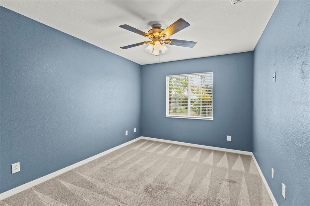11754 Tempest Harbor Loop Venice, FL 34292 - Photo 17 of 56 a view of a big room with windows and chandelier fan