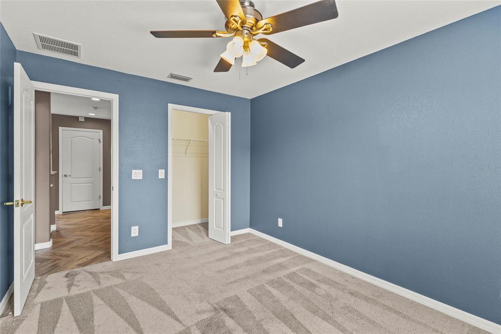 11754 Tempest Harbor Loop Venice, FL 34292 - Photo 18 of 56 a view of a hallway with a chandelier fan
