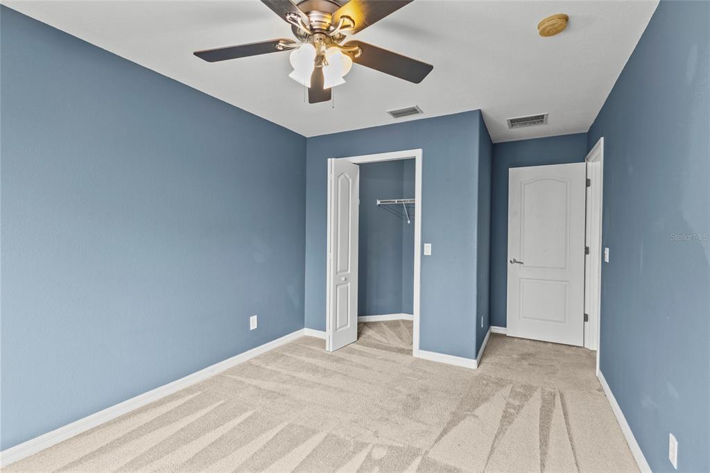 11754 Tempest Harbor Loop Venice, FL 34292 - Photo 20 of 56 a view of an empty room with chandelier fan