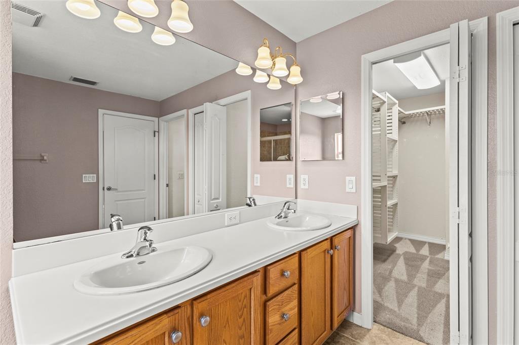11754 Tempest Harbor Loop Venice, FL 34292 - Photo 25 of 56 a bathroom with a sink double vanity and a mirror