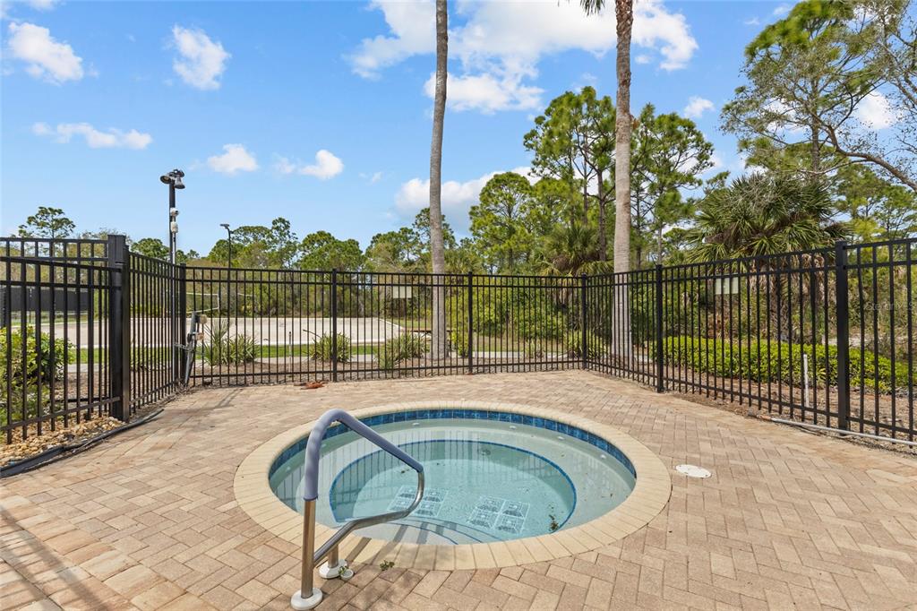 11754 Tempest Harbor Loop Venice, FL 34292 - Photo 37 of 56 a view of a swimming pool with a patio and a garden