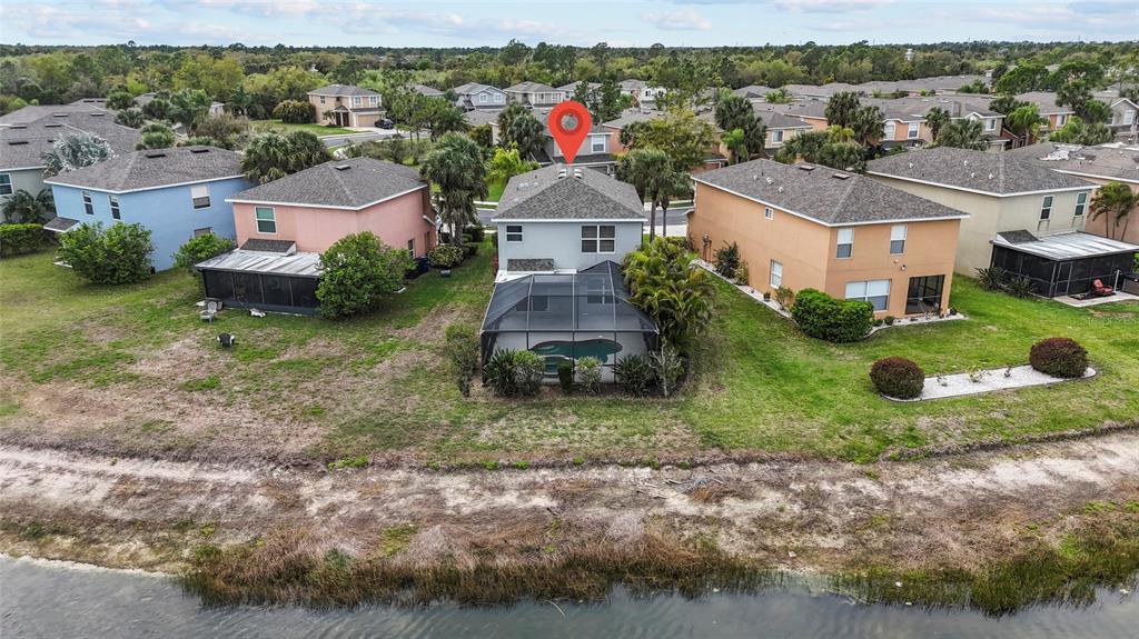 11754 Tempest Harbor Loop Venice, FL 34292 - Photo 41 of 56 an aerial view of residential houses with outdoor space and parking