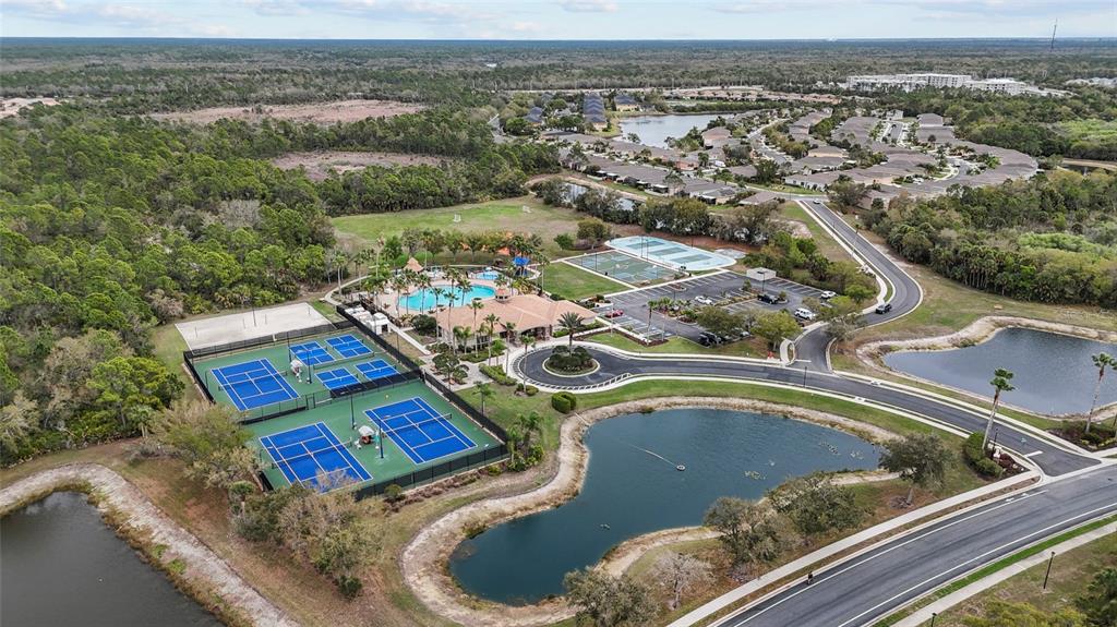 11754 Tempest Harbor Loop Venice, FL 34292 - Photo 48 of 56 an aerial view of a house swimming pool and a yard