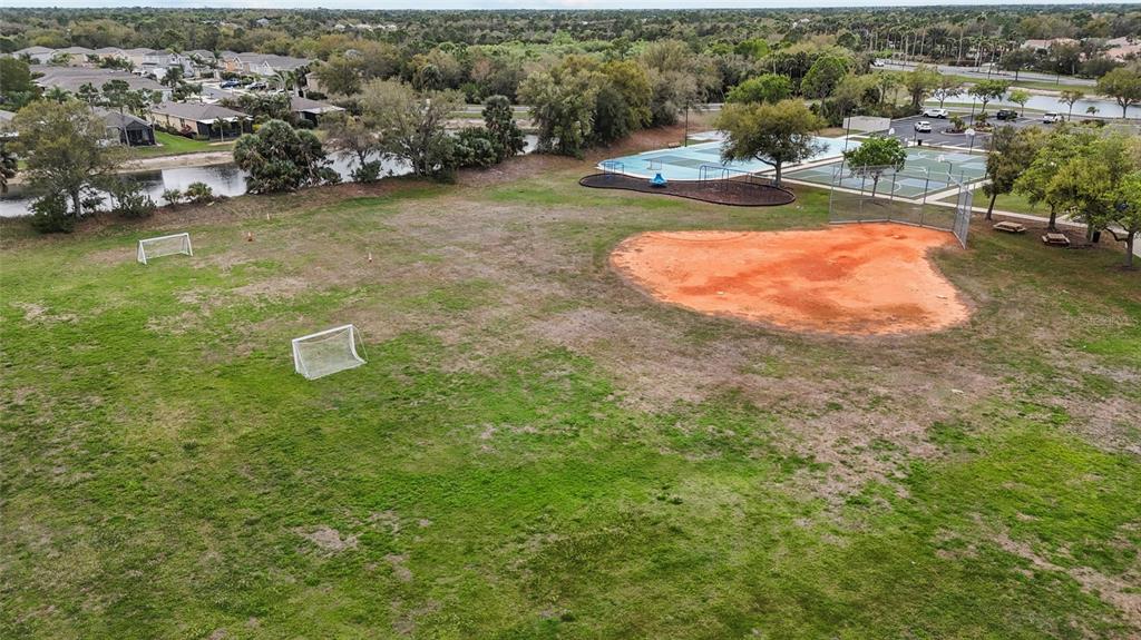 11754 Tempest Harbor Loop Venice, FL 34292 - Photo 51 of 56 an aerial view of a house with a yard