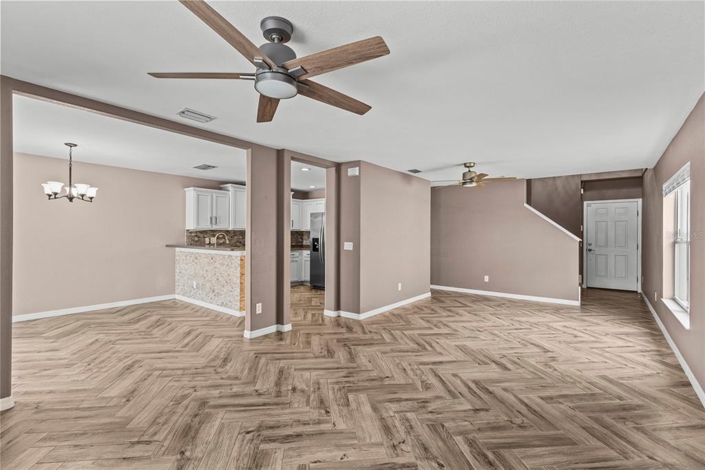 11754 Tempest Harbor Loop Venice, FL 34292 - Photo 6 of 56 a view of a livingroom with a ceiling fan
