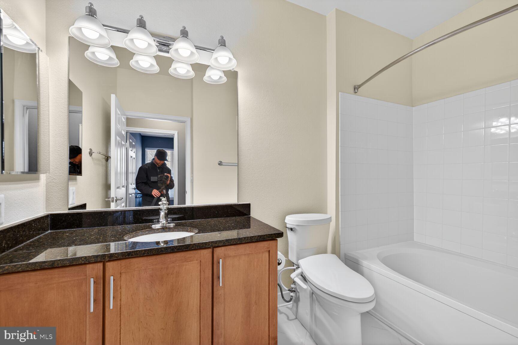 11800 Old Georgetown Road, Unit 1541 North Bethesda, MD 20852 - Photo 11 of 34 a bathroom with a sink a toilet and bathtub
