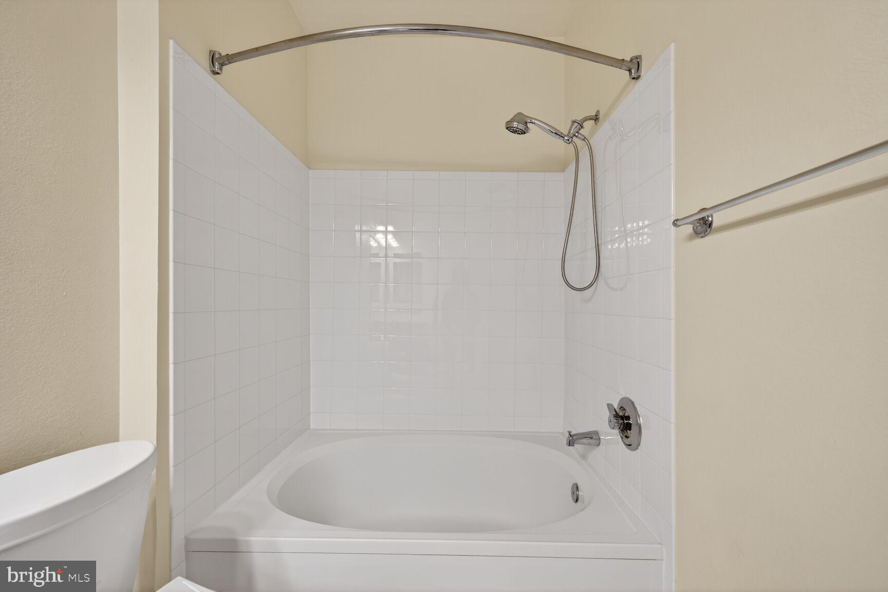 11800 Old Georgetown Road, Unit 1541 North Bethesda, MD 20852 - Photo 12 of 34 a bathroom with a shower and a bath tub