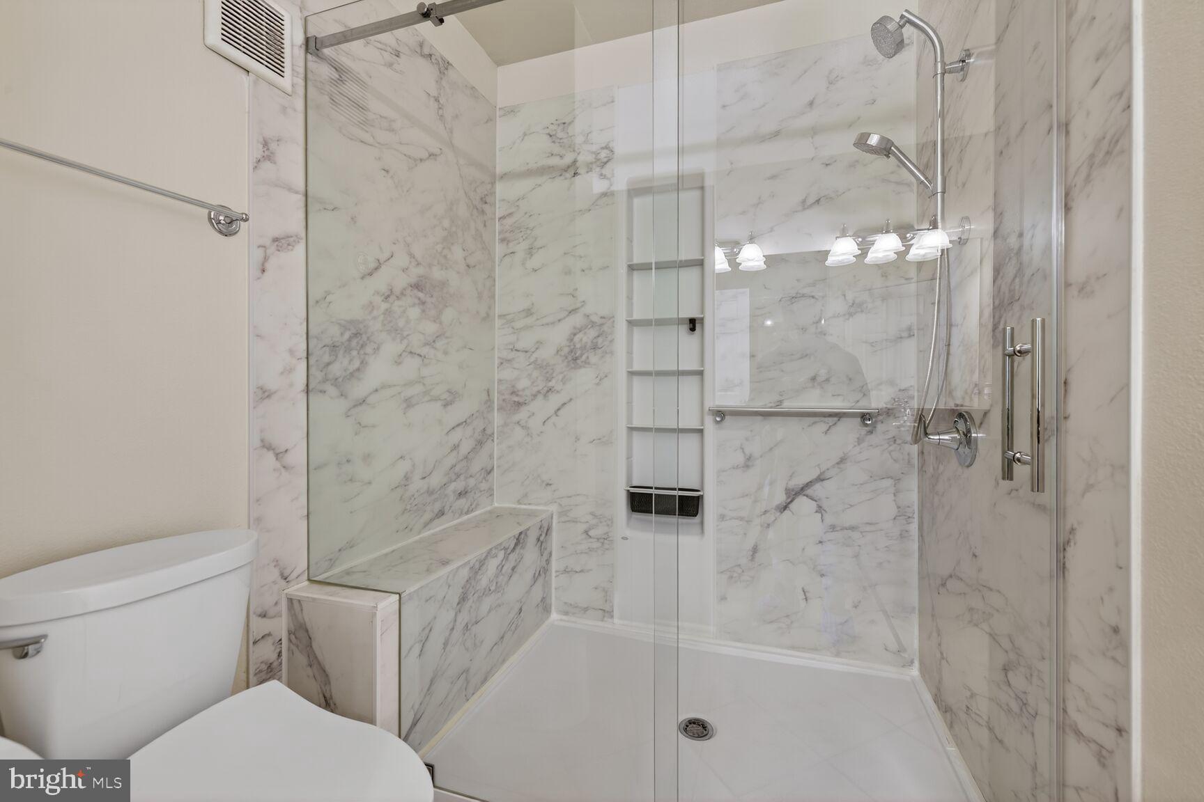 11800 Old Georgetown Road, Unit 1541 North Bethesda, MD 20852 - Photo 16 of 34 a bathroom with a toilet and shower