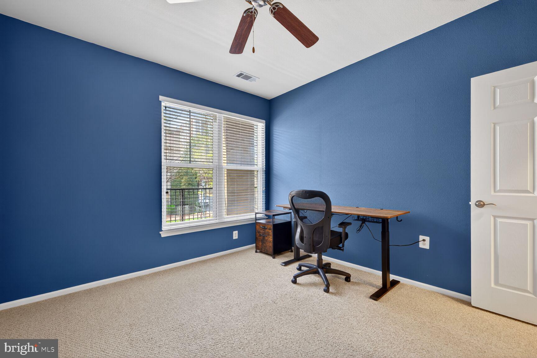 11800 Old Georgetown Road, Unit 1541 North Bethesda, MD 20852 - Photo 9 of 34 a view of a workspace with furniture and a window