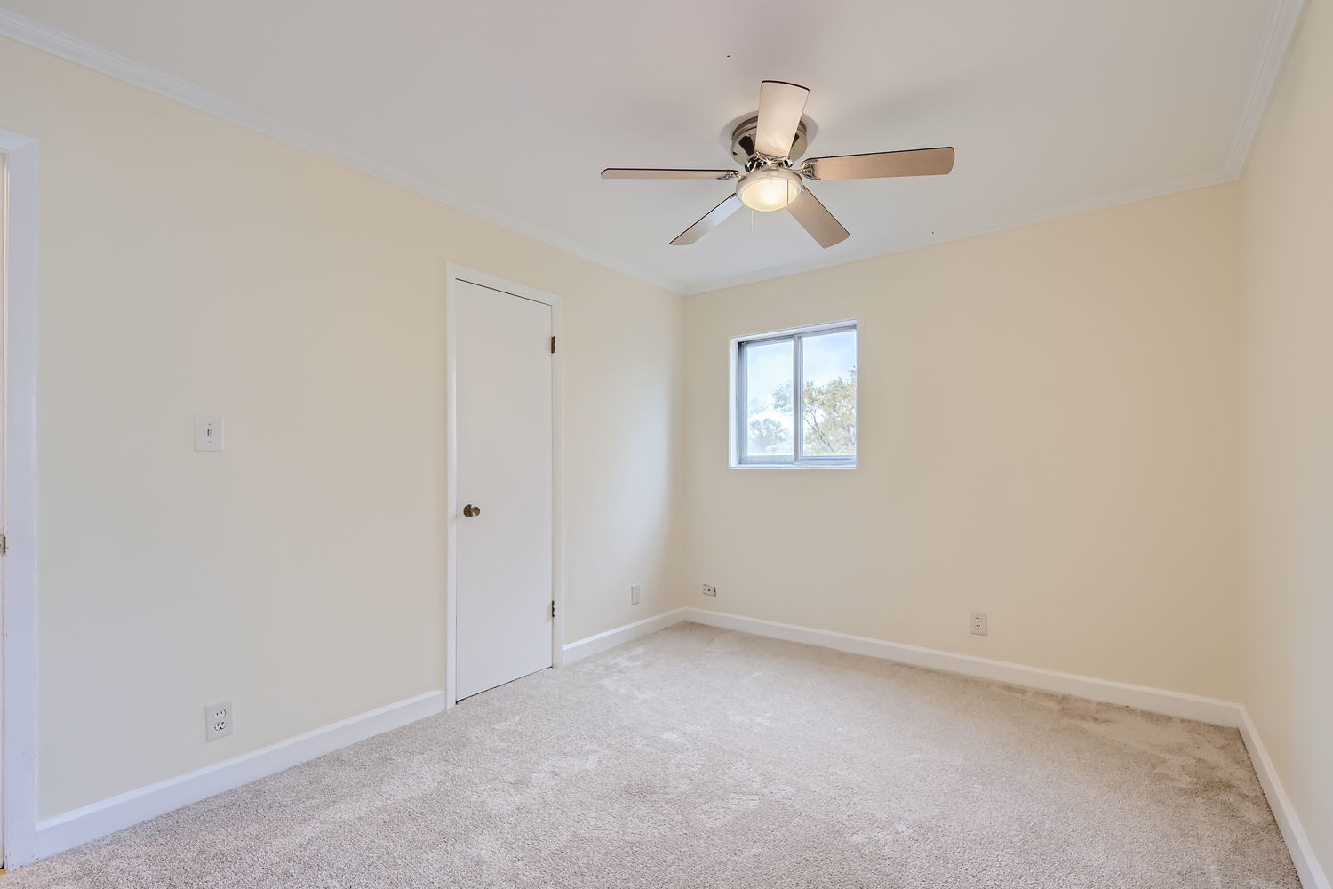 303 Audubon Road Streamwood, IL 60107 - Photo 13 of 30 an empty room with a window and a fan