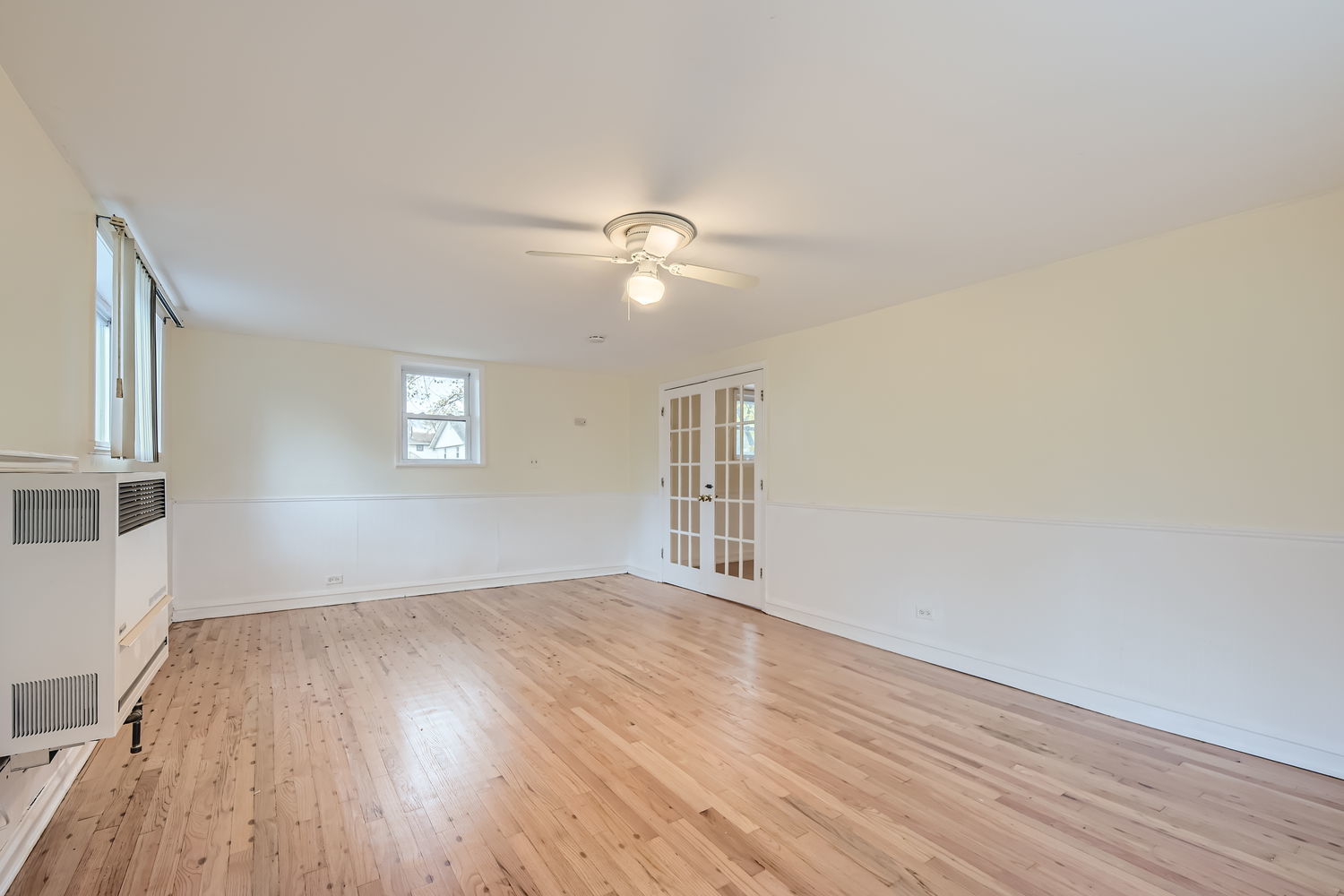 303 Audubon Road Streamwood, IL 60107 - Photo 16 of 30 wooden floor in an empty room with a window