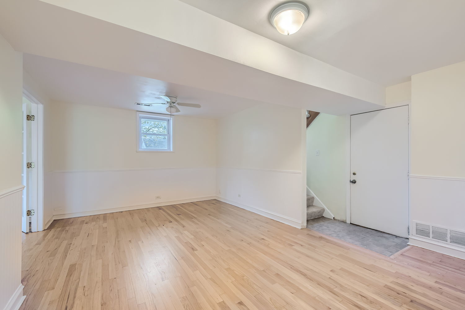 303 Audubon Road Streamwood, IL 60107 - Photo 24 of 30 an empty room with wooden floor and windows