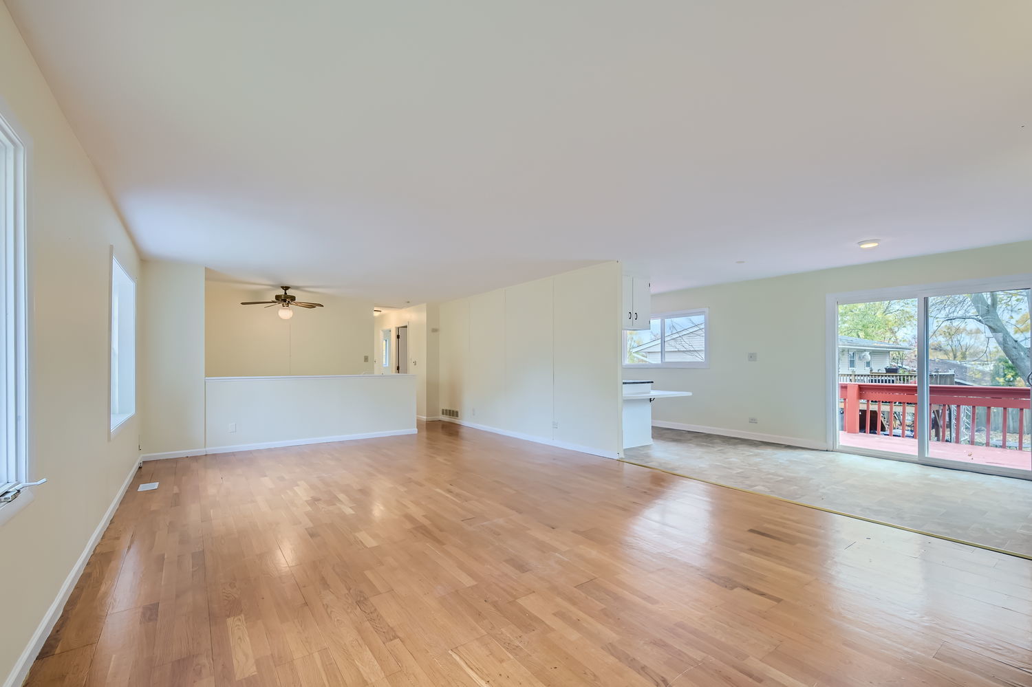 303 Audubon Road Streamwood, IL 60107 - Photo 4 of 30 a view of an empty room with wooden floor and a window