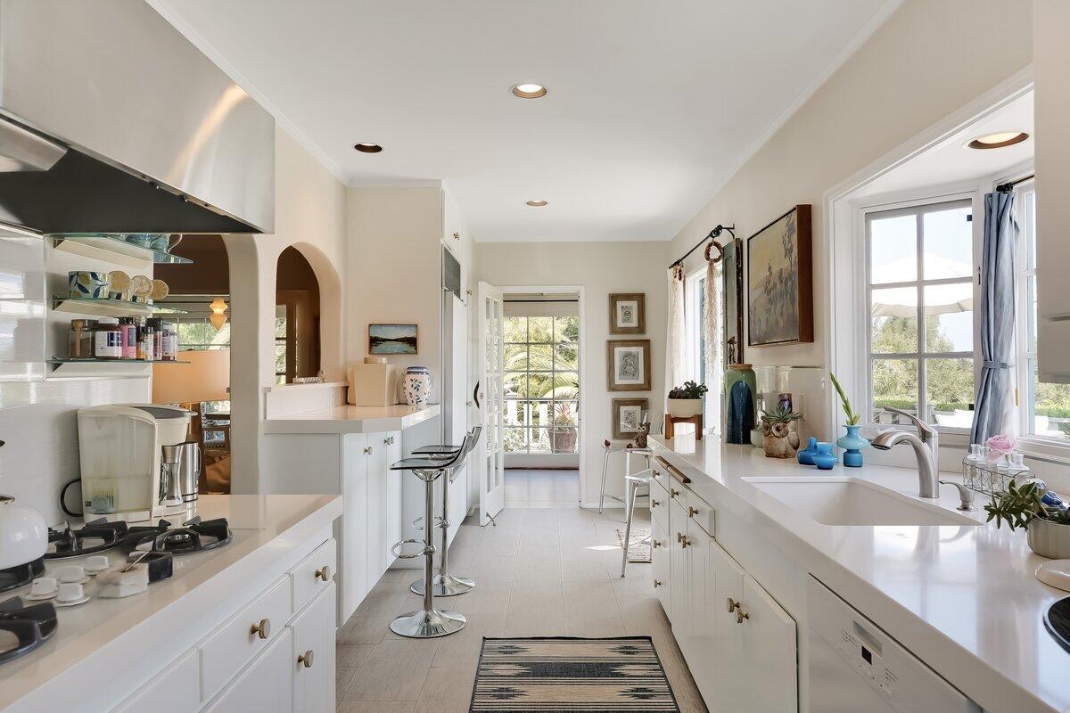 0 Medio Road Santa Barbara, CA 93103 - Photo 15 of 20 a large kitchen with granite countertop a large counter top appliances and furniture