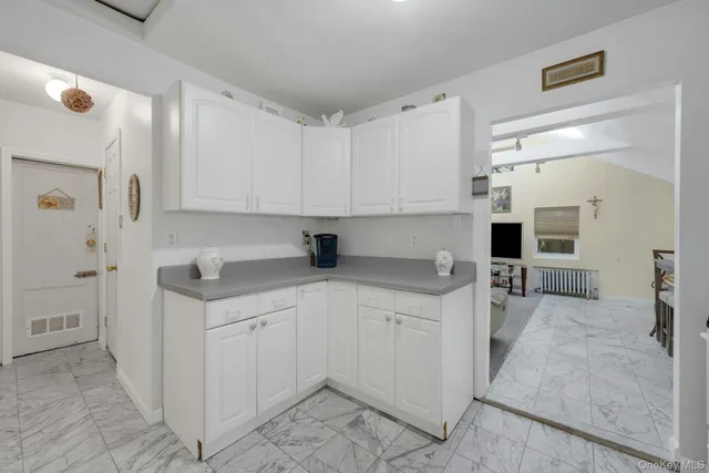 a kitchen with stainless steel appliances a sink stove and cabinets