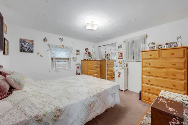 a bedroom with a bed and a cabinets