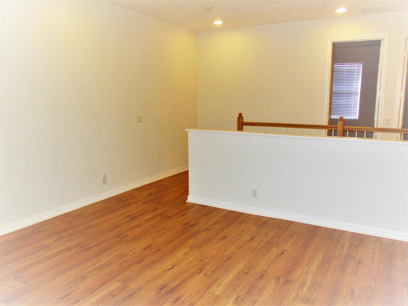 116 Lancaster Road Boynton Beach, FL 33426 - Photo 12 of 28 wooden floor in a an empty room