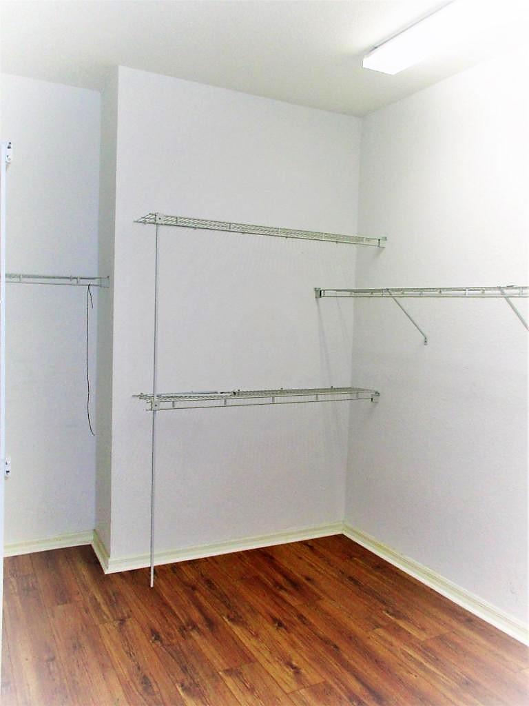 116 Lancaster Road Boynton Beach, FL 33426 - Photo 19 of 28 a view of an empty walk in closet with empty racks