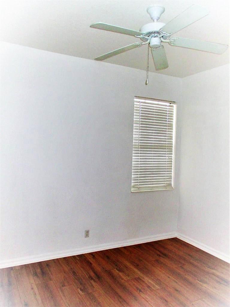 116 Lancaster Road Boynton Beach, FL 33426 - Photo 20 of 28 an empty room with a window and a ceiling fan