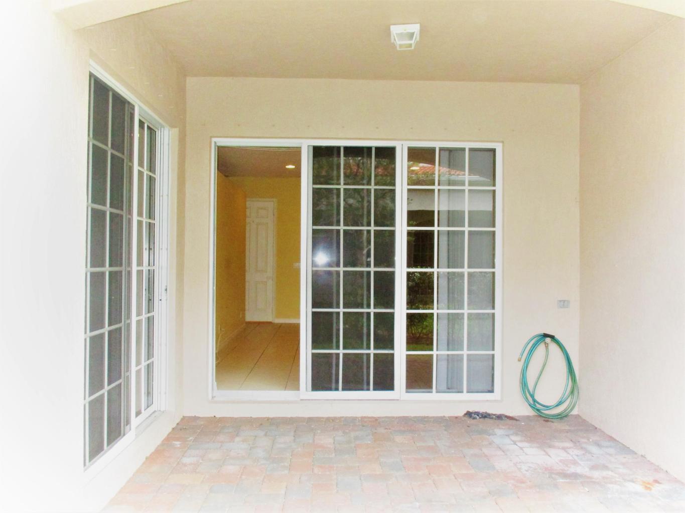 116 Lancaster Road Boynton Beach, FL 33426 - Photo 25 of 28 a view of a door and a window
