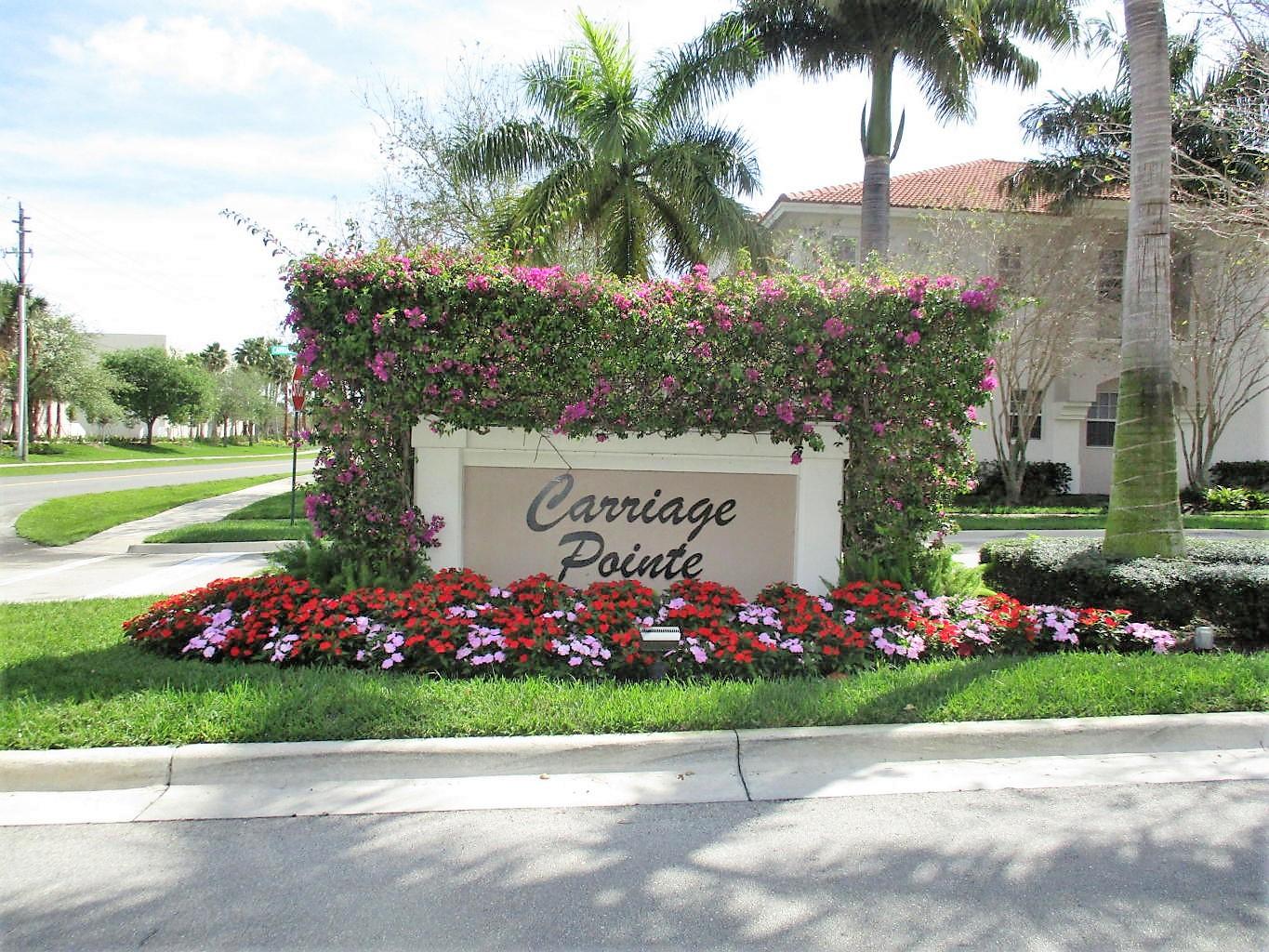 116 Lancaster Road Boynton Beach, FL 33426 - Photo 28 of 28 a street with lots of trees and flowers