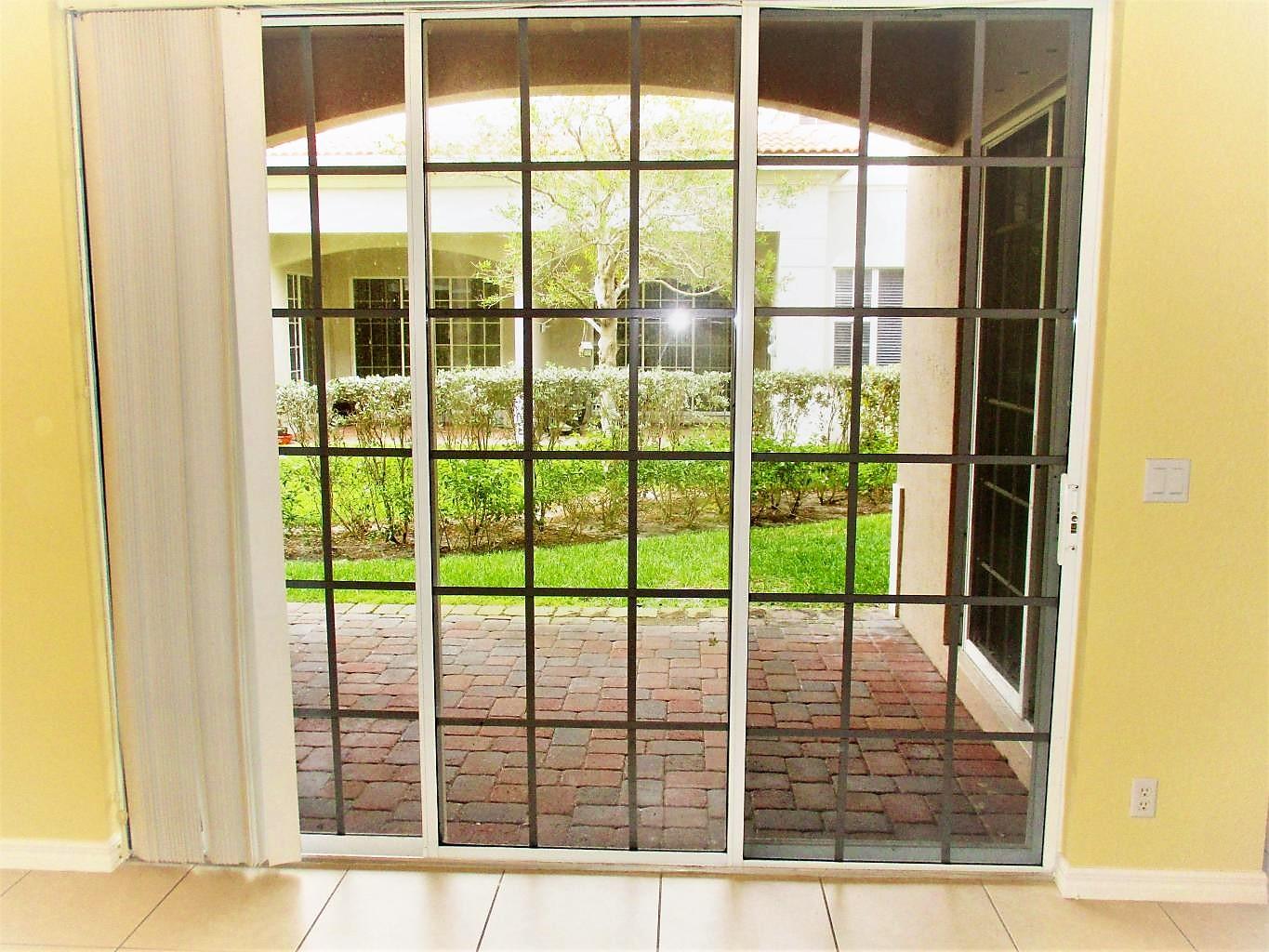 116 Lancaster Road Boynton Beach, FL 33426 - Photo 4 of 28 a view of a glass door