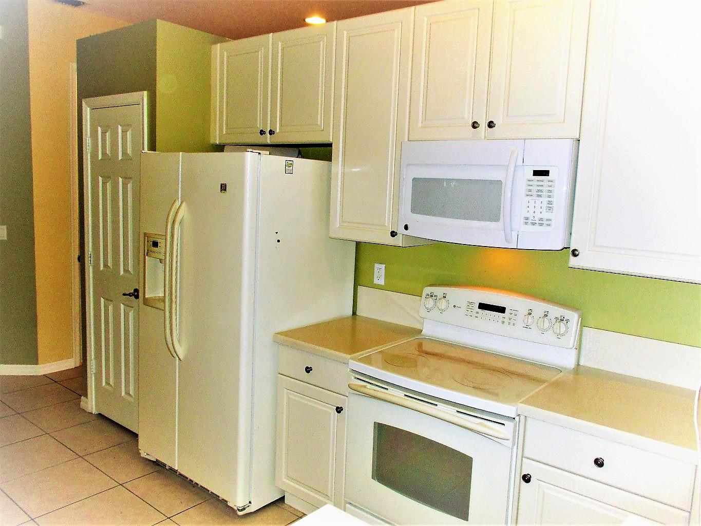 116 Lancaster Road Boynton Beach, FL 33426 - Photo 6 of 28 a utility room with dryer and washer