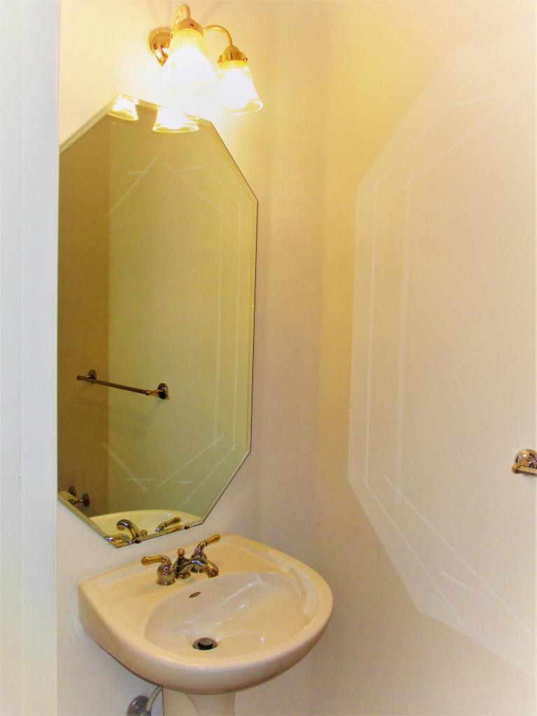116 Lancaster Road Boynton Beach, FL 33426 - Photo 10 of 28 a bathroom with a sink and mirror