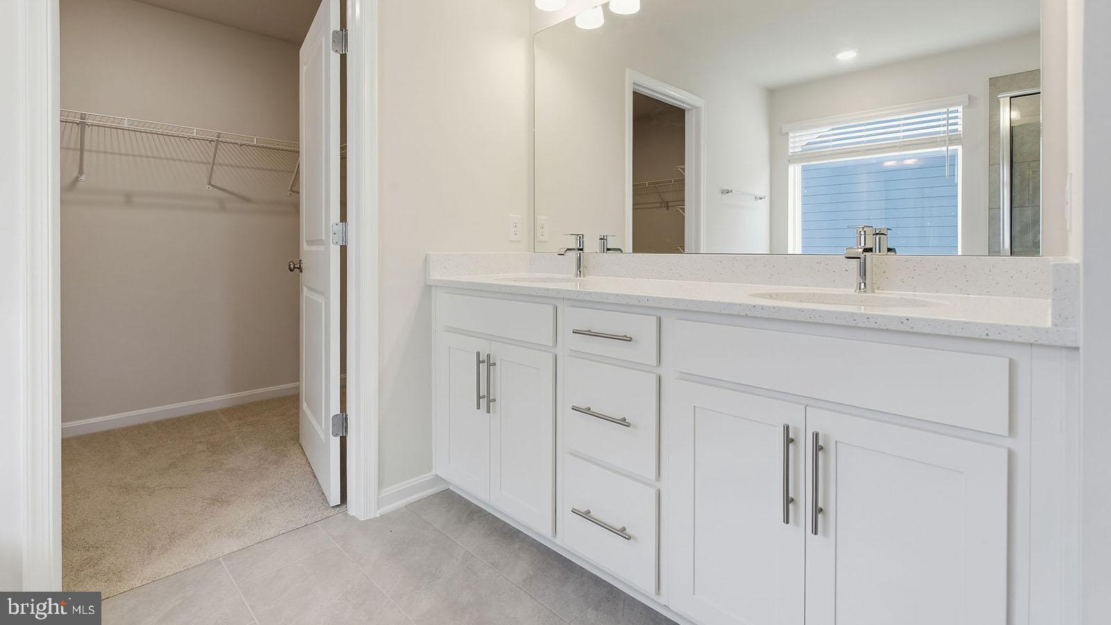 8110 Cypress Pt Drive Rosedale, MD 21237 - Photo 18 of 37 a spacious bathroom with a sink and a mirror