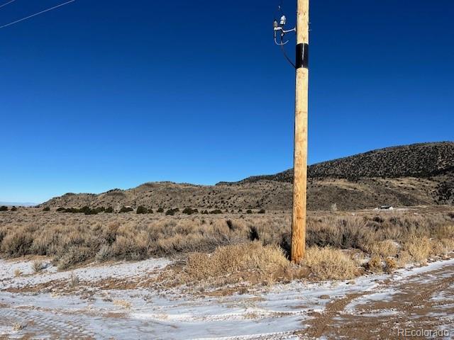 549 Bateman Road Fort Garland, CO 81133 - Photo 3 of 11 a view of a road with a mountain in the background