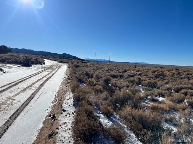 549 Bateman Road Fort Garland, CO 81133 - Photo 8 of 11 a view of a large body of water with lots of bushes