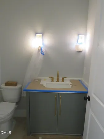 a kitchen with stainless steel appliances a stove a refrigerator and a sink