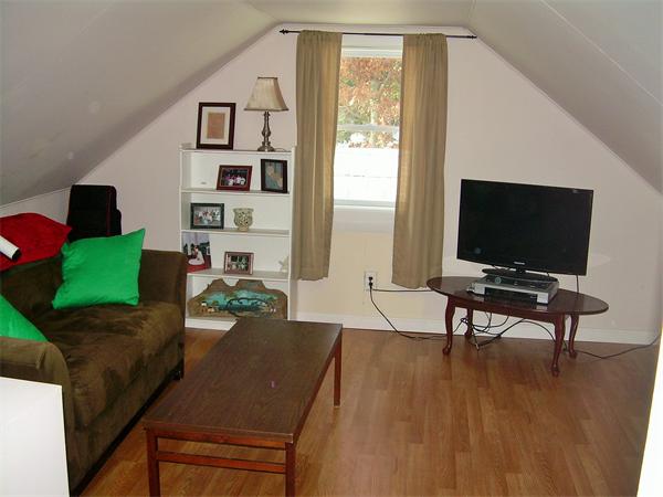 1 Anthony Road Peabody, MA 01960 - Photo 19 of 29 a living room with furniture and a flat screen tv