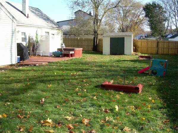 1 Anthony Road Peabody, MA 01960 - Photo 23 of 29 a backyard of a house with table and chairs