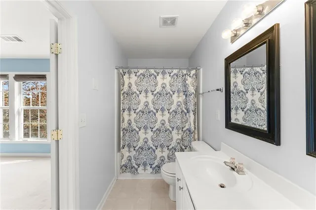 a bathroom with a bathtub sink and toilet
